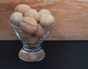  walnuts in a glass vase