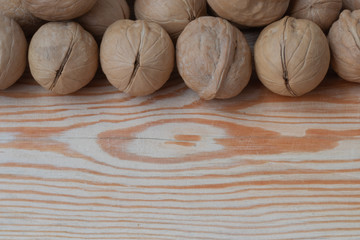  ripe walnut on wooden background