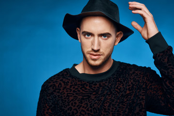 portrait of young man in a hat