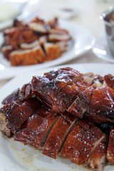 Cantonese cuisine roast duck with roast pork in the background