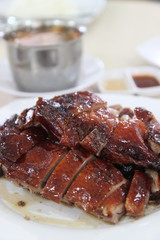 Cantonese cuisine roast duck with roast pork in the background