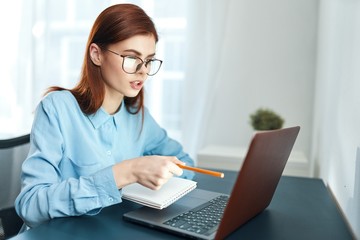 businesswoman working on laptop in office