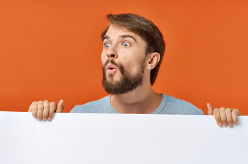 man holding blank board