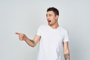 young man pointing at something interesting