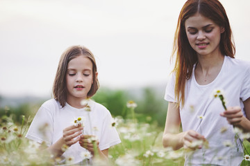 Fototapeta premium mother and daughter with flowers