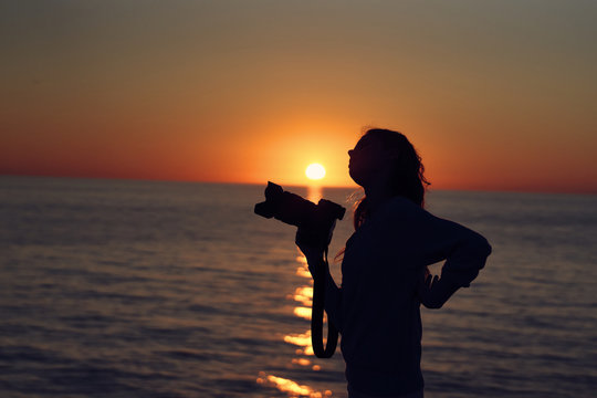silhouette of woman at sunset