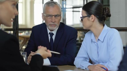 Businesspeople hearing lie in partners talk, using psychology in communication