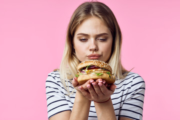 young woman with hamburger