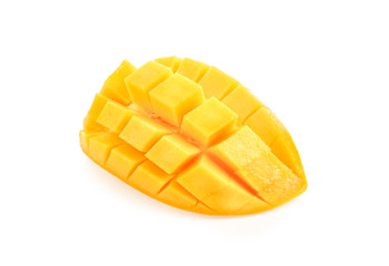 Ripe yellow Mangoes cut half in cubes isolated on white background.