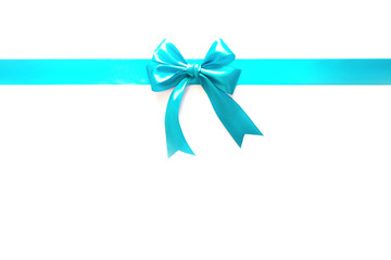 Blue ribbon with a bow as a gift on a white background