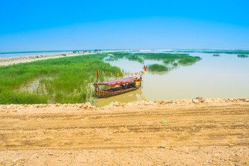 Fototapeta premium a long boat in river indus pakistan