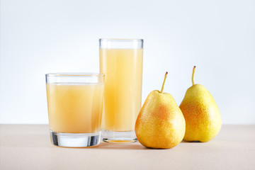 Pear Juice with fresh fruits on kitchen table. Healthy drink.