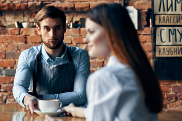 man drinking coffee in cafe
