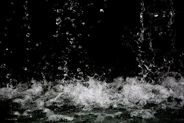 Movement of the Water splash on black background. Water drop from the fountain. Can use for add...