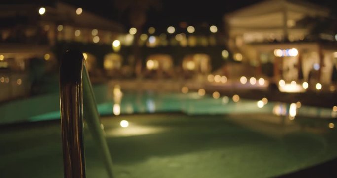 Blurry Hotel / Resort Pool Area - Evening - slow motion