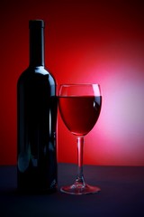 Glass Of Wine And Wine Bottle Without Label