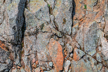 Rock background with cracks between the stones.