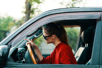 Fototapeta premium young woman in car