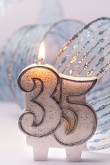 lit number candles with a ribbon