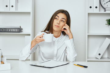businesswoman talking on phone in office