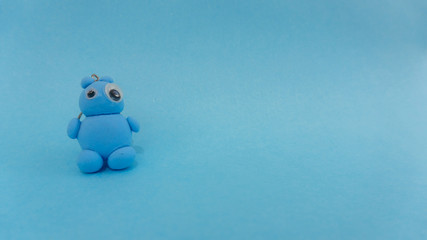 blue clay toy on blue background