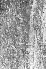 monochrome background of peeling paint wall. Black and white background with paint removed from the wall. Monochrome peeling wall texture