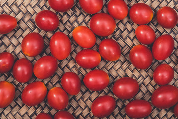 background of cherry tomatoes in wooden plate