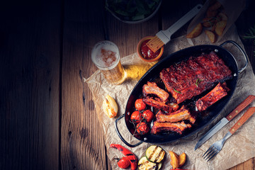 Grilled ribs in spicy marinade with salad and vegetables - obrazy, fototapety, plakaty