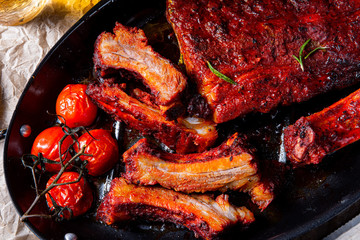 Grilled ribs in spicy marinade with salad and vegetables