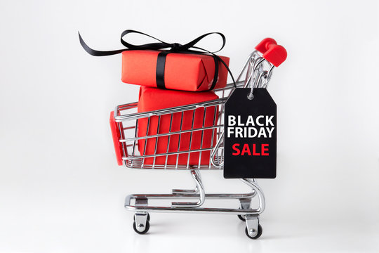 Black friday shopping cart with red gift box