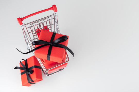 Red Gift Box With Black Bow In Shopping Cart, Black Friday Background