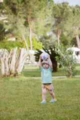 boy playing with a ball in the park