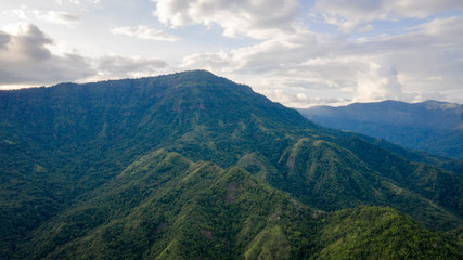 Fototapeta premium Aerial view of mountains and chewed roads on the mountain during sunset at Khao Kho Viewpoint, Phetchabun Province, Thailand
