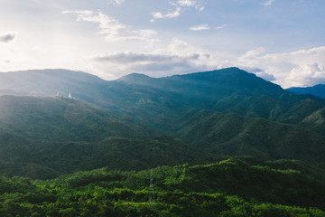 Aerial view of mountains and chewed roads on the mountain during sunset at Khao Kho Viewpoint, Phetchabun Province, Thailand