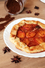 Apricot pie with coffee on kitchen table. Summer berry biscuit recipe.