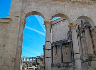 The Diocletian's Palace in Split, Croatia. Beautiful architecture of unique ancient buildings and many tourists in the old city on blue sky background on a sunny day. 