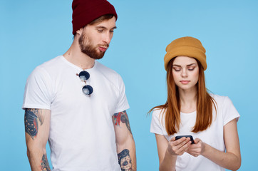 young couple with phones