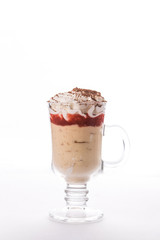 Tasty dessert with whipped cream in Coffee glass isolated on white background