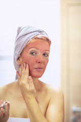 woman with a face mask. - Skincare and cosmetics concept..