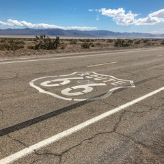 The famous Route 66 emblem painted on Route 66 in the California Desert. 