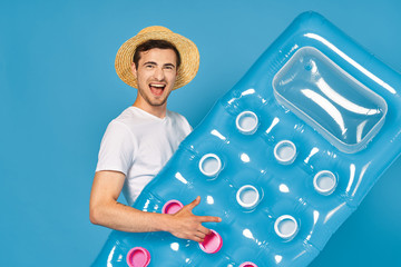 Fototapeta premium man with inflatable mattress