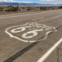 The famous Route 66 emblem painted on Route 66 in the California Desert. 