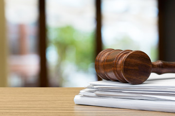 Wooden gavel on table close up. Justice concept