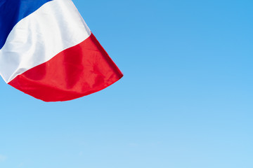 Flag of France waving in the wind in the sky