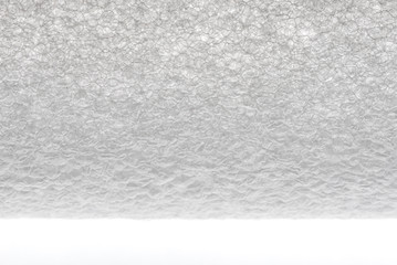 Fototapeta na wymiar A white extruded polyethylene foam tube texture isolated on white background
