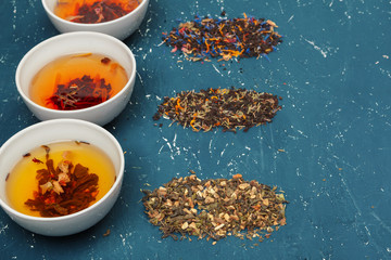 herbal tea in cups on a wooden background