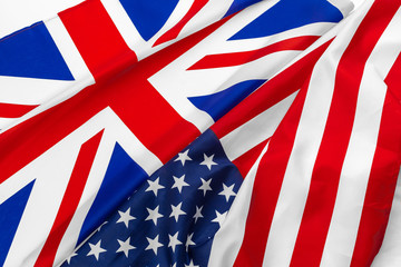 Flags of the USA and brithish Union Jack flag together waving
