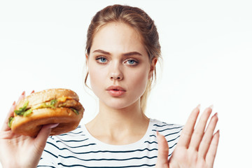 beautiful woman with perfect skin with hamburger 