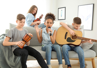 Teenage musicians playing and singing at home