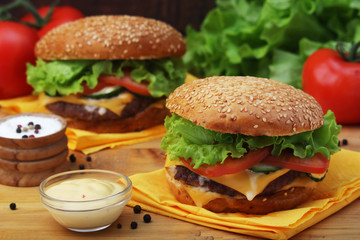 Two fresh hamburgers with vegetables	